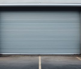 Closed gray roller shutters, closed storage area or garage, warehouse space closed gray roller shutters